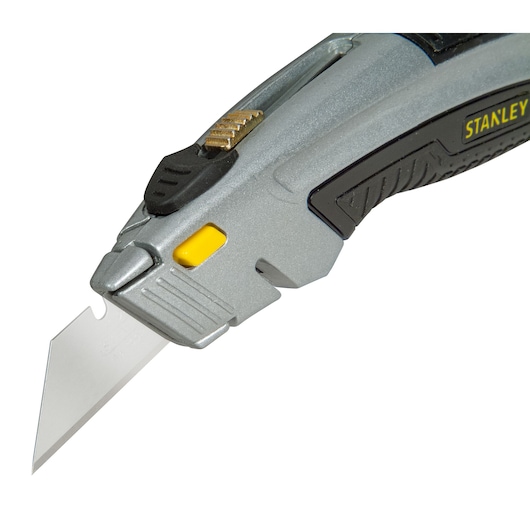 STANLEY 0-10-788 silver utility knife, angled view showing extended blade and black grip.