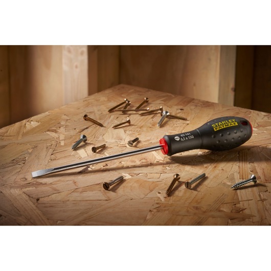 STANLEY® FATMAX® Slotted Flared 6.5 x 150mm Screwdriver Environment Shot In a Workshpt Background