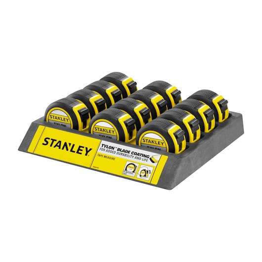STANLEY 1-30-657 tape measures in black and yellow display tray, front angle on white background.