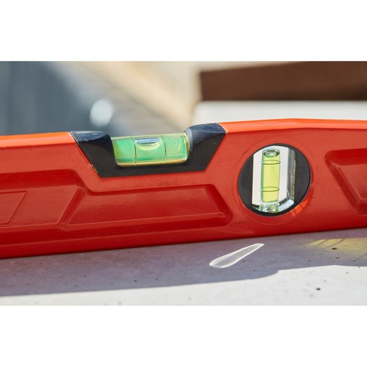 STANLEY 1-42-314 red spirit level close-up, showing vial details, photography outdoors.