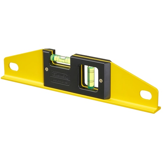 Stanley spirit level with yellow body, two vials, and mounting holes, designed for accurate alignment tasks.