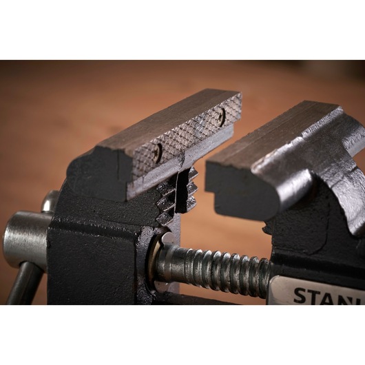 STANLEY 1-83-065 bench vise close-up showing textured steel jaws and screw mechanism, product photography.