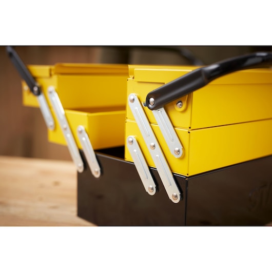 STANLEY 1-94-738 yellow and black metal toolbox, close-up side photography.