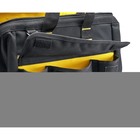 STANLEY 1-96-183 tool bag in black and yellow, front pocket with Velcro flap, close-up angle.