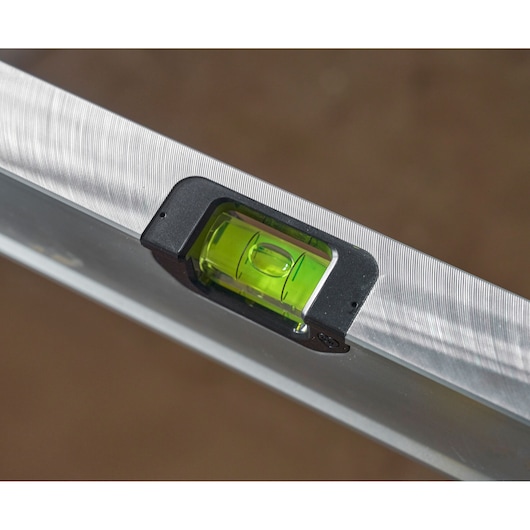 STANLEY FMHT43674-1 spirit level close-up showing green vial and aluminum body, product photography.