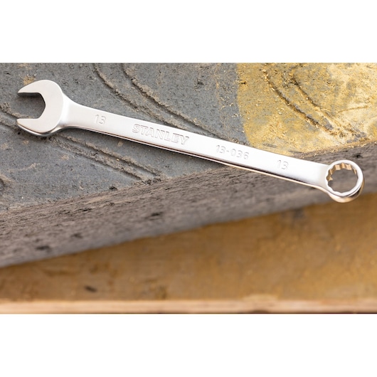 STANLEY FMMT13032-0 combination wrench, silver, angled view on textured surface.