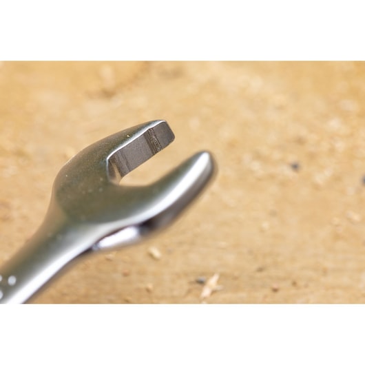 STANLEY FMMT13071-0 open end wrench close-up on wood surface, silver metallic finish, tool photography.