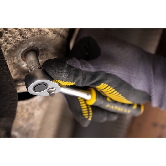 Photo of STANLEY FMMT17193-0 ratchet wrench in use for tightening bolt, close-up view.