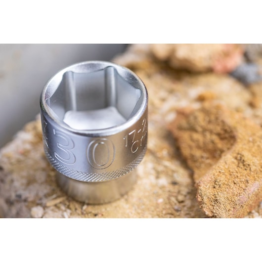STANLEY FMMT17210-0 socket tool, close-up angle, metallic silver finish, shown on a rough surface.