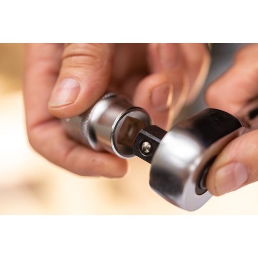 STANLEY FMMT17238-0 ratchet and socket close-up in use, silver metallic tool, photography category