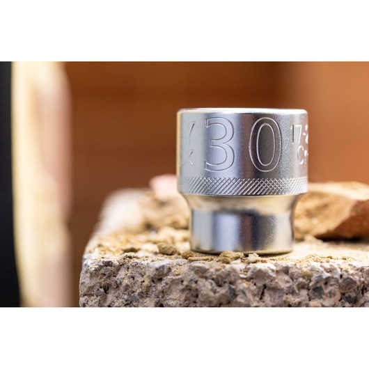 STANLEY FMMT17240-0 socket, 30mm, silver, close-up photo on rough concrete, tool category.
