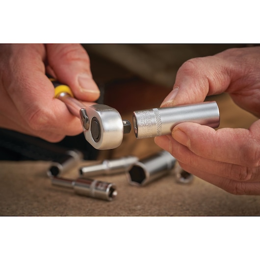 STANLEY FMMT17963-0 ratchet handle and socket in use, close-up photography, silver metallic finish.