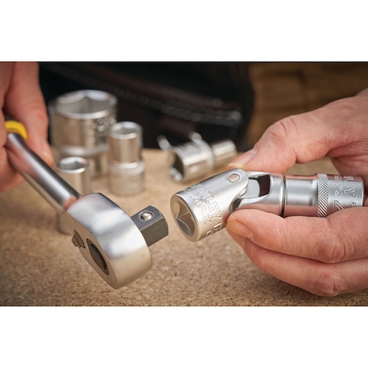 STANLEY FMMT17999-0 socket and ratchet set in use, close-up photo on work surface.