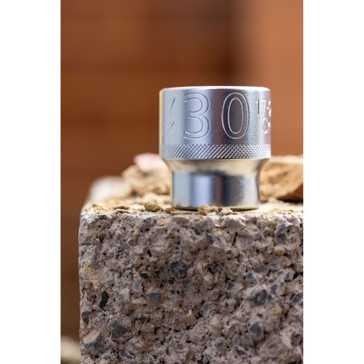 STANLEY FMMT82679-0 chrome socket, 30mm size, photography of product standing upright on rough stone surface.