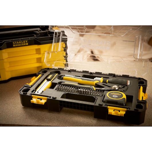 Photo of STANLEY FMMT98106-1 tool set with tape measure, pliers, bits, and screwdriver in a yellow and black case.