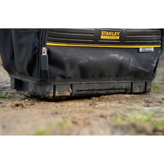 Photo of STANLEY FMST17626-1 tool bag with black fabric, sturdy plastic base, and STANLEY FATMAX branding.