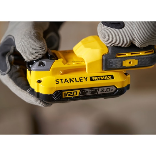 STANLEY SFMCD711B cordless tool with V20 FATMAX 2.0Ah lithium-ion battery, close-up view.
