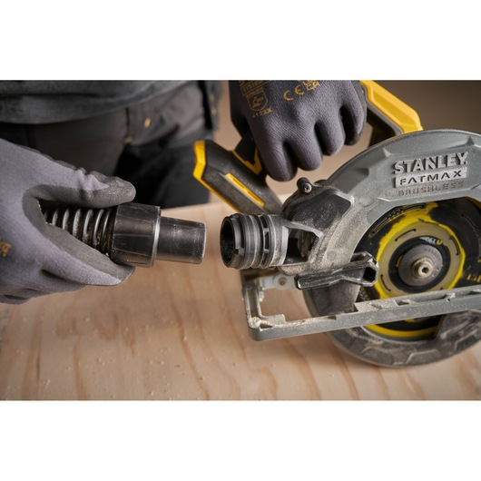 STANLEY SFMCS551M1T circular saw side view with dust extraction hose attachment.