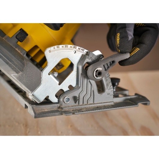 STANLEY SFMCS551M1T circular saw bevel adjustment close-up photo on wood surface.