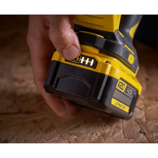 Photo of STANLEY SFMCS650B 18V FATMAX V20 Brushless Jigsaw battery indicator being pressed, close-up.