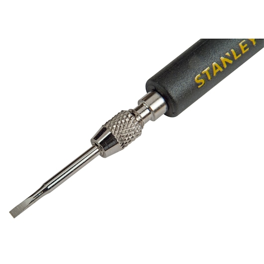 Close-up of a Stanley precision flathead screwdriver with textured grip and metal shaft.