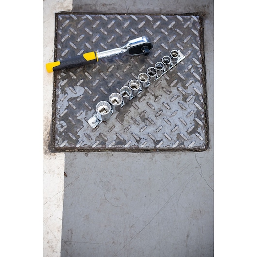 STANLEY STMT82666-0 ratchet and socket set photographed on metal surface.