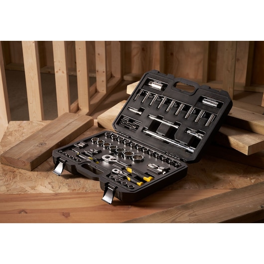 STANLEY STMT82831-1 ratchet and socket set with 72 pieces in black hard case, shown on wood surface.