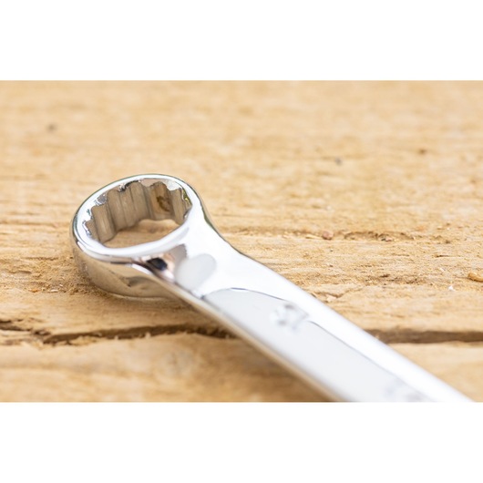 STANLEY STMT82842-0 combination wrench close-up on wood, showing polished chrome finish.