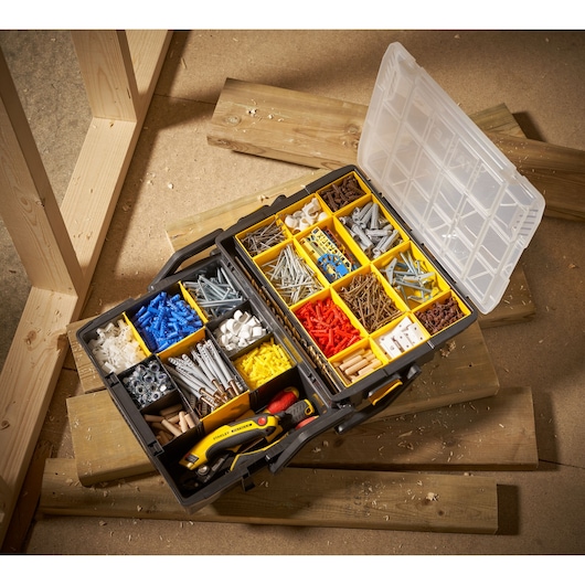STANLEY STST1-75540 organizer box top view with assorted screws, anchors, hardware, and hand tools.