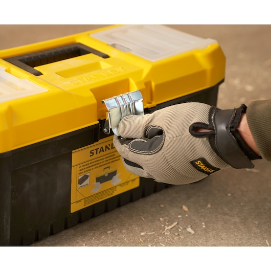 Stanley STST75785-1 toolbox, yellow and black, front angle, glove hand opening latch.