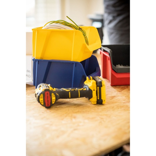 STANLEY STST82740-1 storage bins in yellow, blue, red with tools on wood surface, photography angle.